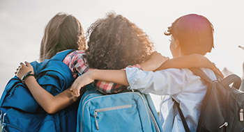 Children embrace on a school field trip